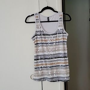 Super cute tank with iridescent circle sequins.